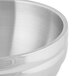 A Vollrath stainless steel double wall beehive serving bowl.