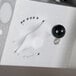 A close-up of a Doyon dough sheeter's white and black knobs.