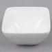 a white square bowl on a gray background