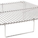 A stainless steel Optimal Automatics Party Que grill rack with a handle.