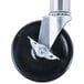 A black and silver wheel with a metal plate and a metal base.