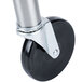 A close-up of a black and silver wheel with a metal cylinder.