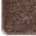 A brown square Vollrath Miramar granite resin template on a brown surface.