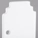 A white rectangular object with a hole in the center.