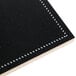 A black chalkboard label with white stitching.