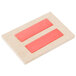 A rectangular white chalkboard label with red rectangles.