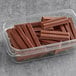 A plastic container of KIT KAT chocolate bars.