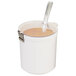 A white round melamine jar lid with a notch in it.