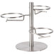 A stainless steel tiered display stand with three round notched jar holders.