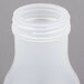 A close-up of Tablecraft Teardrop Polypropylene Syrup Dispenser Jar with a lid on it.