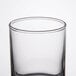 A clear glass Libbey votive shot glass.