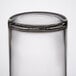 A Libbey clear glass votive shot glass with a lid.