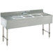 An Advance Tabco stainless steel underbar sink with three compartments and two drainboards.