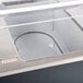 An Advance Tabco buffet table with an open metal well and clear cover.