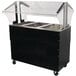 A black Advance Tabco buffet table with clear ice-cooled wells.