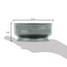 A hand holding a measuring cup fills a grey Cambro Shoreline entree bowl.