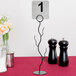 A Tablecraft black branch table card holder.
