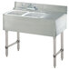 A stainless steel Advance Tabco underbar sink with two bowls and a left side drainboard.