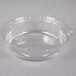A clear plastic container with a round lid.