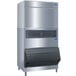 A large stainless steel Manitowoc water cooled ice machine.