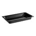 A black Carlisle rectangular plastic food pan on a counter.