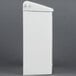 A white plastic Rochester Midland sanitary napkin receptacle with a lid.