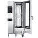 The open door of a Convotherm stainless steel roll-in combi oven.