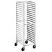 An Advance Tabco metal sheet pan rack with wheels.