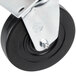 A close-up of a 4" replacement swivel plate caster wheel with a black wheel and metal plate.