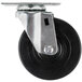 A close-up of a 4" black and silver swivel plate caster wheel.