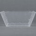 A clear square styrene bowl by American Metalcraft.