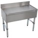 A stainless steel Advance Tabco free-standing bar drainboard with legs.