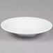 A CAC Super Bright White Coupe Porcelain Bowl on a white background.