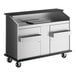 A heavy-duty portable bar with stainless steel doors, interior, and wheels for mobility.
