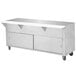 An Advance Tabco stainless steel food table with sliding doors and a cabinet base.