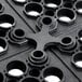 A black plastic connector with holes.