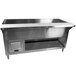 A stainless steel refrigerated cold pan table with an enclosed base.