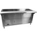 A stainless steel refrigerated cold pan table with sliding doors on a counter.