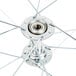 A close up of a Carnival King 13" white wheel with a hub.