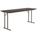 A rectangular Correll walnut seminar table with metal legs.