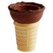 A chocolate dipped flat bottom ice cream cone with chocolate swirls.