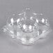 A clear plastic InnoPak cupcake container with four high domed compartments.