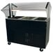 A black Advance Tabco buffet cold pan table with clear covers over the wells.