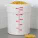 a large white measuring cup with noodles inside