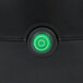 A green button on a black Avantco power switch.