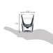 A hand holding a Libbey fluted shot glass with a 1 oz. pour line.