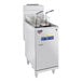 A Pitco stainless steel floor gas fryer with several baskets inside.