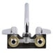 A chrome Equip by T&S wall mount swivel faucet with two brass handles.