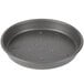 A round black Chicago Metallic BAKALON pizza pan with holes in it.