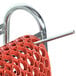 A red and silver metal Cactus Mat floor mat cart with a handle and a basket with holes.